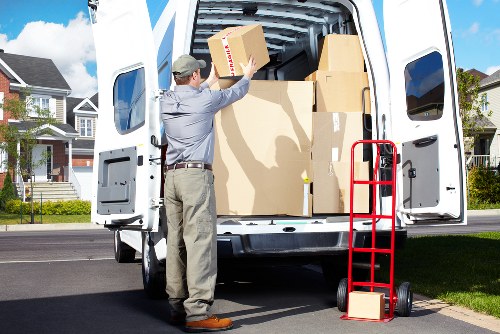 Professional movers carrying boxes during a local home relocation