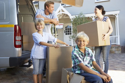 Packed moving boxes and furniture ready for transport in Wallington