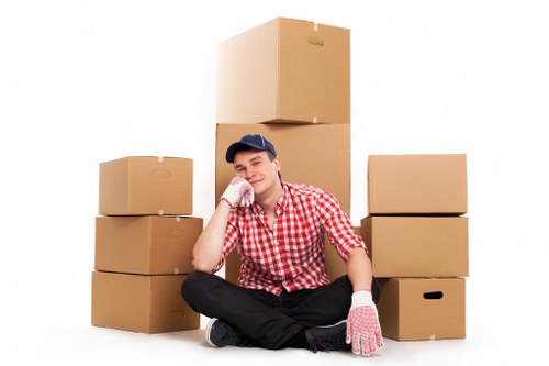 Trained movers carrying furniture safely in Wallington